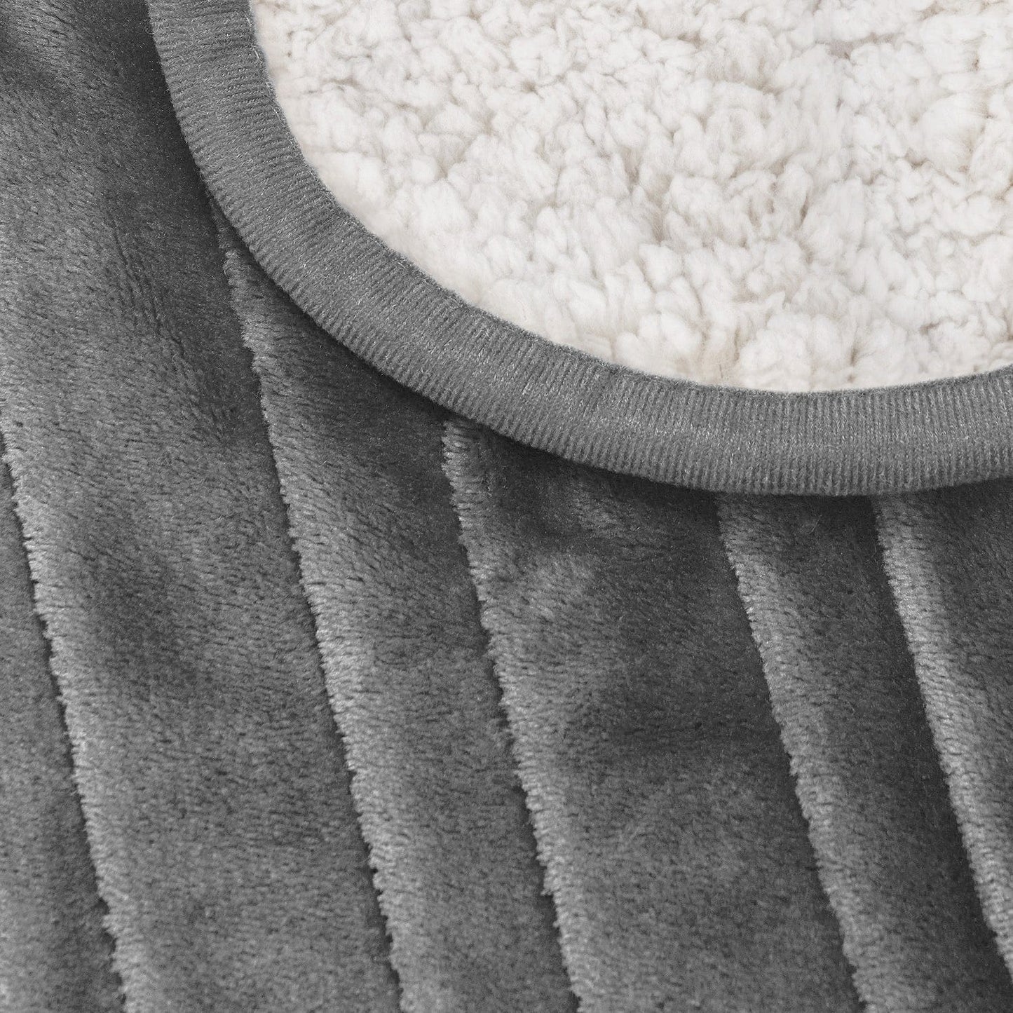 Couverture chauffante en polaire et sherpa